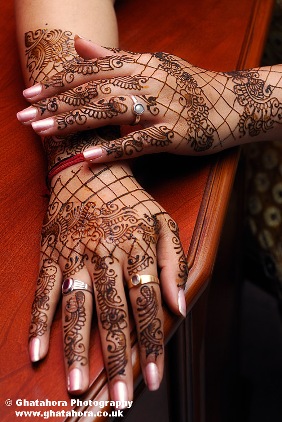 IMG7108 
 Closer view showing the hands and the arms covered with henna. 
 Keywords: Photograph showing the hands and the arms covered with henna. Henna, mendhi, designs, wedding, indian bride, hands, patterns, fashion, body art, tattoo, hands, colour, Bhupinder Ghatahora, Ghatahora Photography