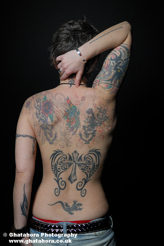 ANI8483 
 Back covered with tribal, flower, birds tattoos, in colour and in black ink. Romantic Tattoos by Bhupinder Ghatahora 
 Keywords: artisc, glamour, portraits, tattoo, tribal, tattoos, stars, devil, butterfly, cherry, flowers, fashion, models, female, male, ink, colour, body art, flower, birds, nude, bhupinder ghatahora, romantic tattoos Back covered with tribal, flower, birds tattoos, in colour and in black ink.