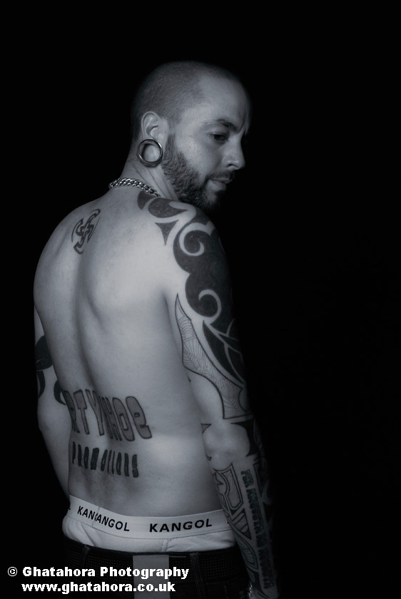 DAV1250 
 Portrait showing tribal tattoos on arms and the back. Romantic Tattoos by Bhupinder Ghatahora 
 Keywords: artisc, glamour, portraits, tattoo, tribal, tattoos, stars, devil, butterfly, cherry, flowers, fashion, models, female, male, ink, colour, body art, flower, bhupinder ghatahora, romantic tattoos Portrait showing tribal tattoos on arms and the back