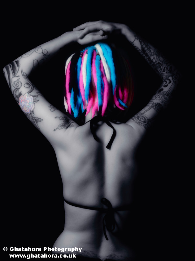 XMS7767 
 Split colouring showing the blue & pink hair, along with the tattoos. Romantic Tattoos by Bhupinder Ghatahora 
 Keywords: Split colouring showing the blue & pink hair, along with the tattoos. artisc, glamour, portraits, tattoo, tribal, stars, devil, butterfly, cherry, flowers, fashion, models, female, male, ink, colour, body art, flower, bhupinder ghatahora, romantic tattoos