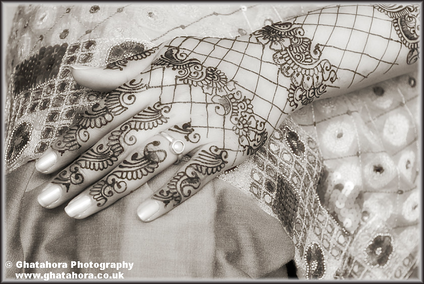IMG7087 
 Close-up black/white photogragh showing the henna covered hand on the knee. 
 Keywords: Close-up black/white photogragh showing the henna covered hand on the knee. Henna, mendhi, designs, wedding, indian bride, hands, patterns, fashion, body art, tattoo, hands, colour, Bhupinder Ghatahora, Ghatahora Photography